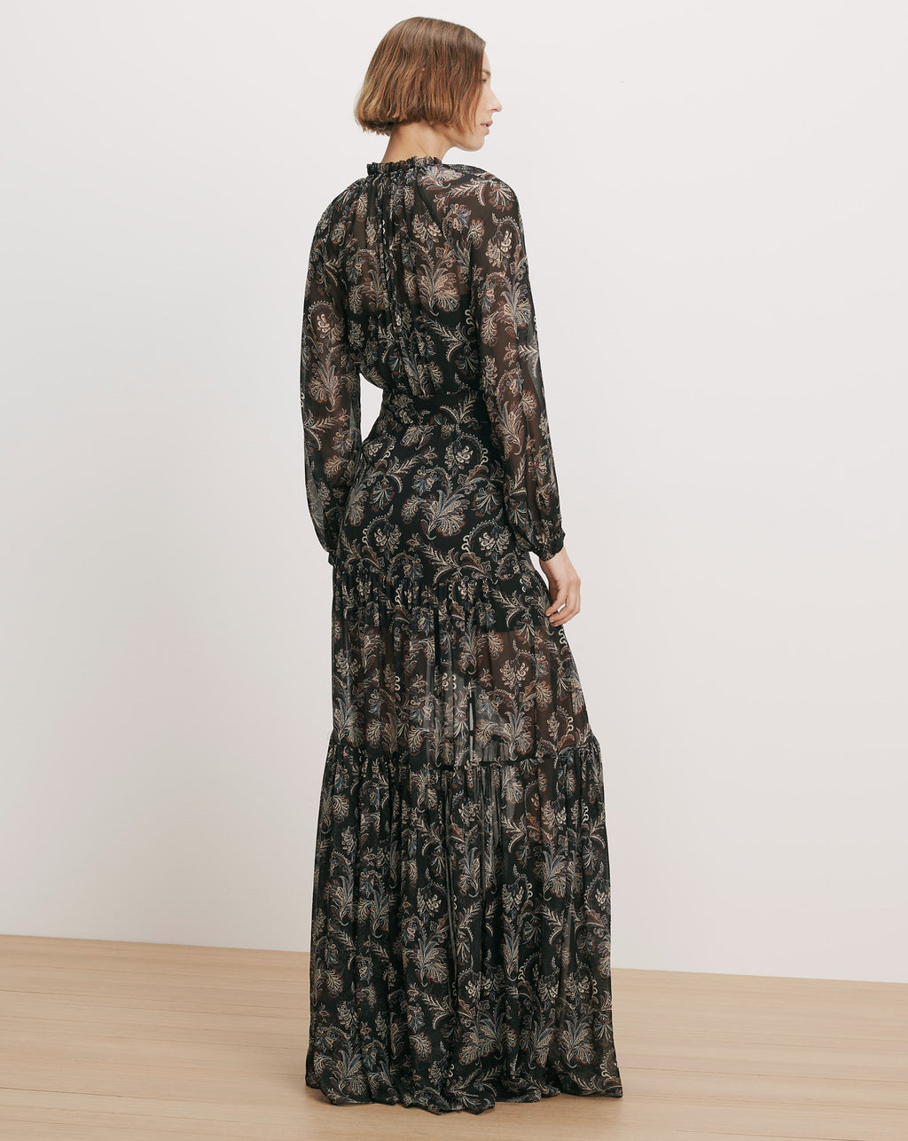 Veronica Beard Black floral print tiered maxi dress with long sleeves.