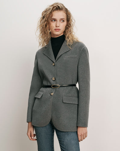 Veronica Beard Gray wool blazer, belted, over black turtleneck.