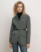 Veronica Beard Gray wool blazer, belted, over black turtleneck.