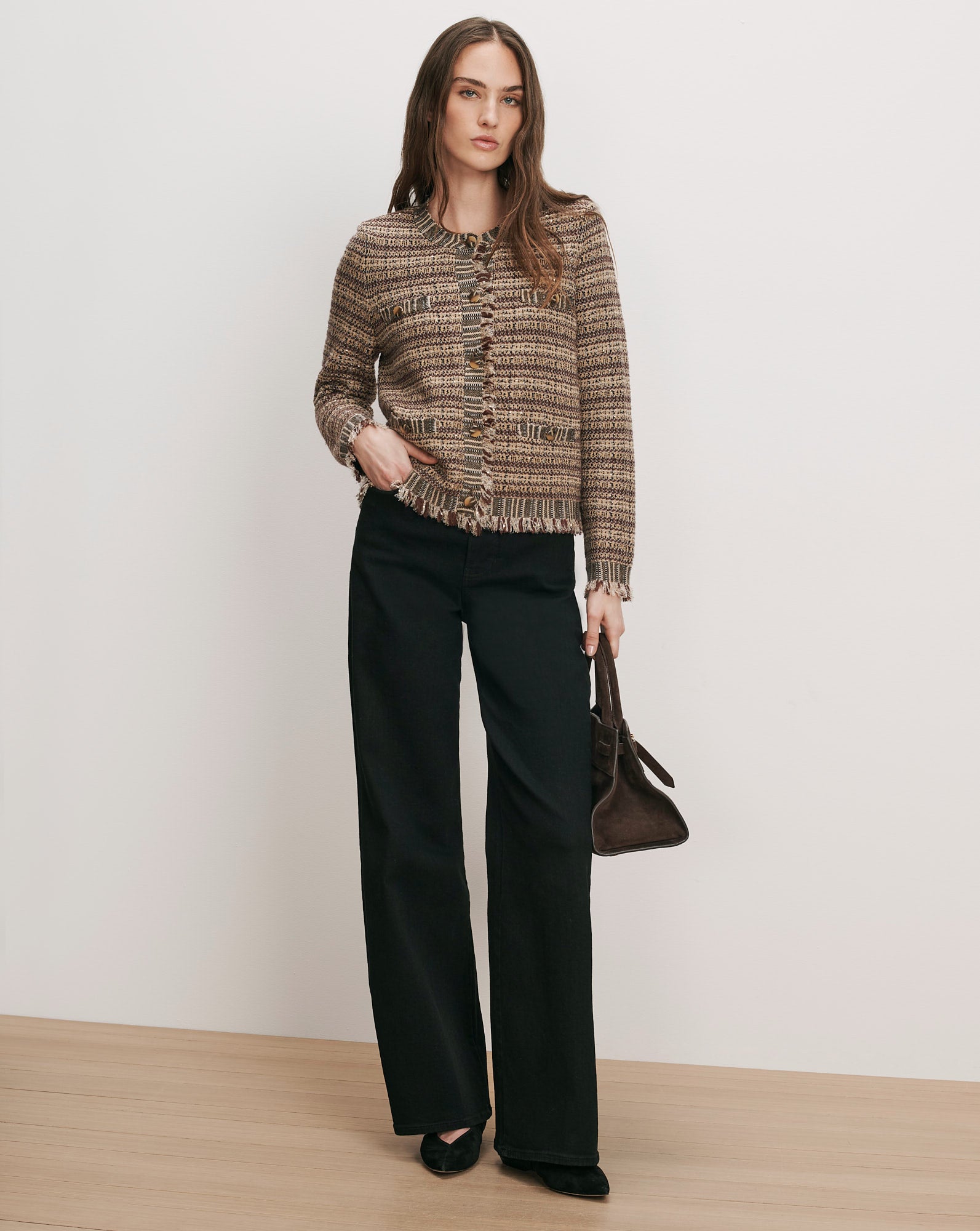 Veronica Beard Brown tweed cardigan, black wide-leg jeans, brown handbag.