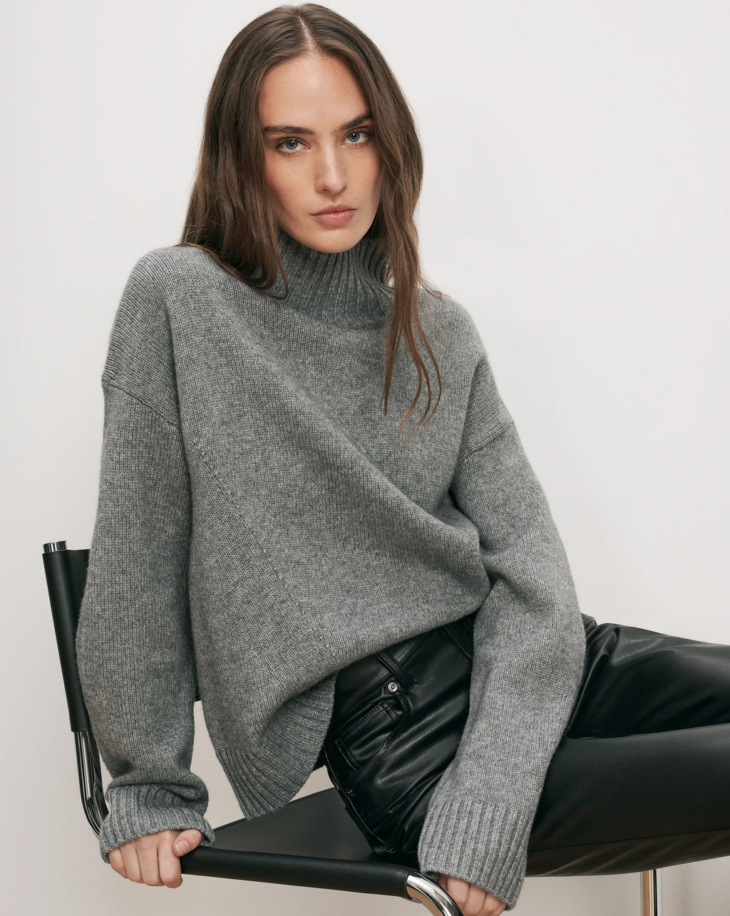Veronica Beard Gray turtleneck sweater, black leather pants.