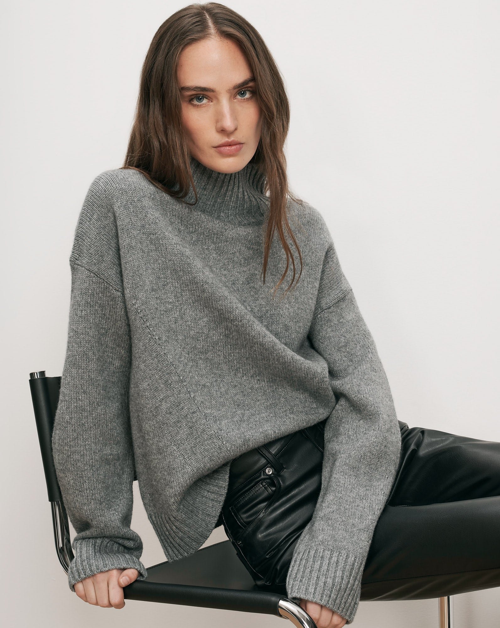 Veronica Beard Gray turtleneck sweater, black leather pants.