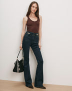 Veronica Beard Brown ribbed tank top, dark wash flare jeans with chain detail.