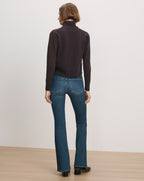 Veronica Beard Purple turtleneck sweater, blue flare jeans