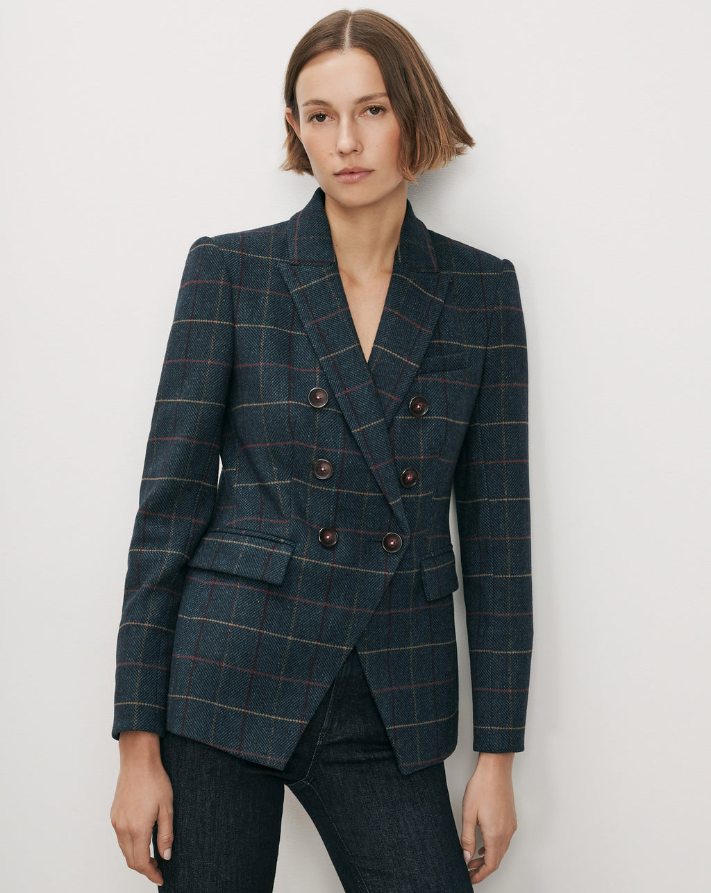Veronica Beard Navy plaid double-breasted blazer with brown buttons.