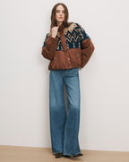Veronica Beard Brown and blue patterned knit jacket, wide-leg jeans.
