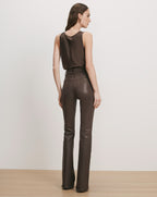 Veronica Beard Brown leather sleeveless top and flared pants.