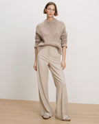 Veronica Beard Beige knit sweater and wide-leg trousers.