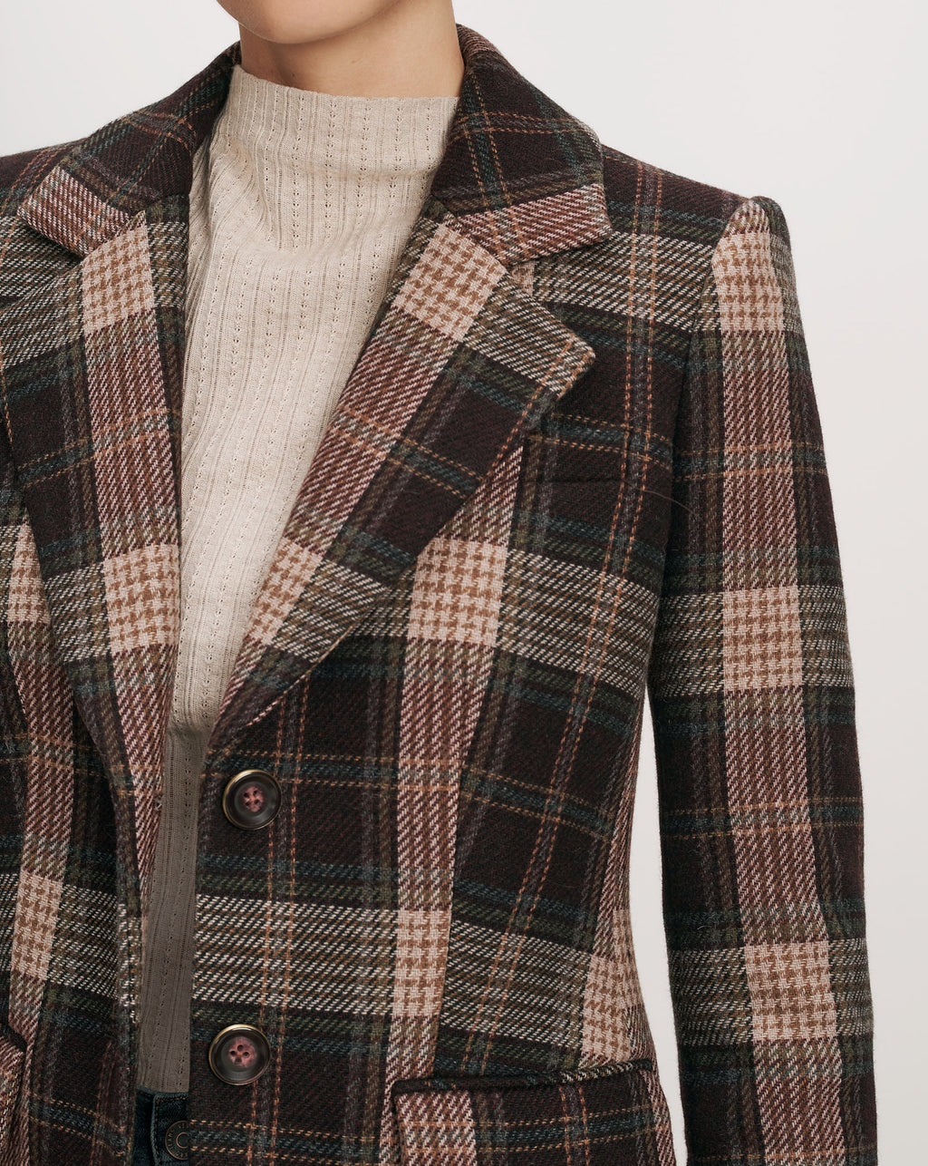 Veronica Beard Brown plaid blazer with a cream turtleneck.
