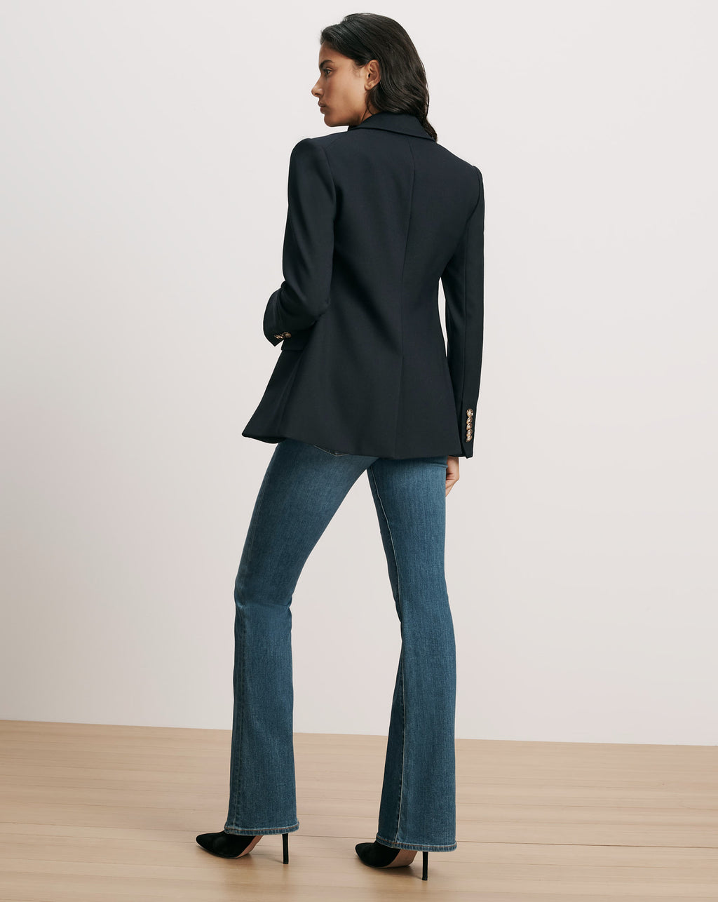 Veronica Beard Navy blazer, gold buttons, and flared jeans.