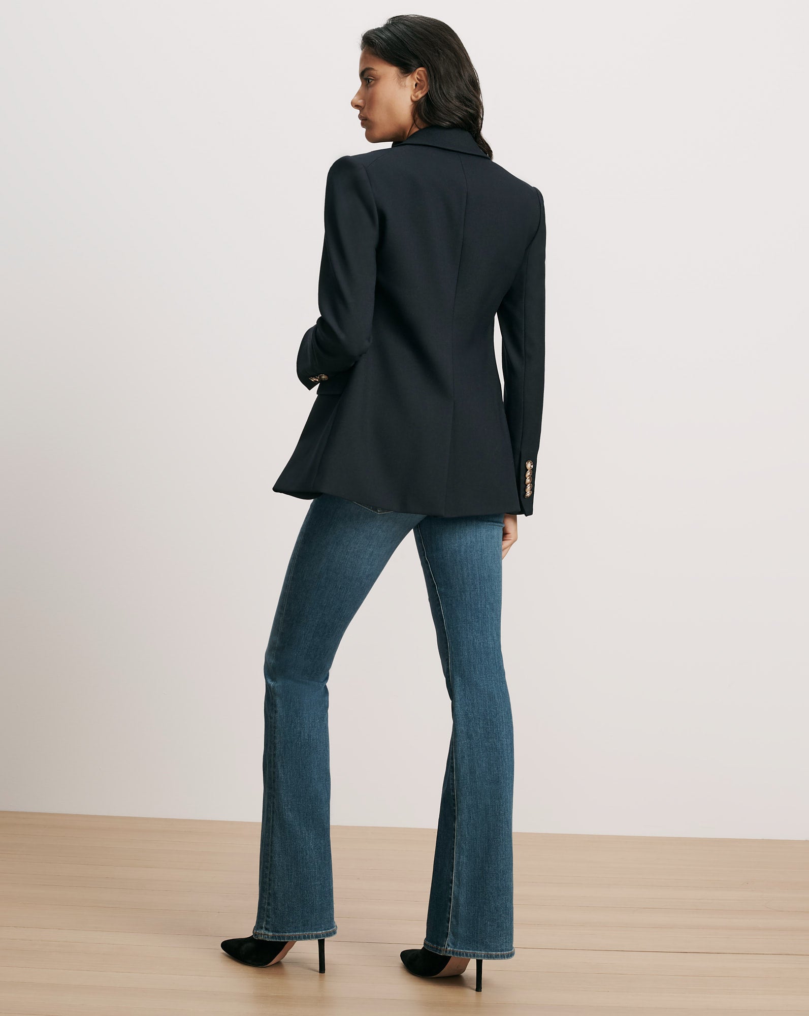 Veronica Beard Navy blazer, gold buttons, and flared jeans.