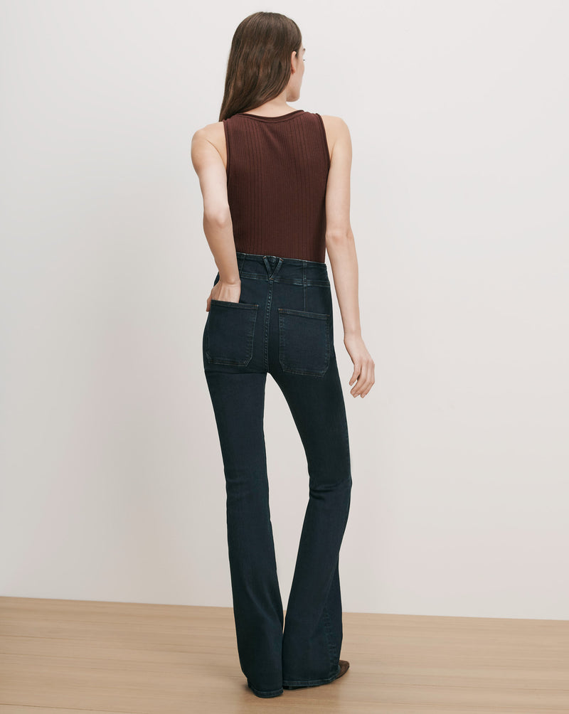 Veronica Beard Dark wash flare jeans and brown ribbed tank top.
