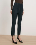 Veronica Beard Dark wash denim stirrup leggings with contrast stitching.