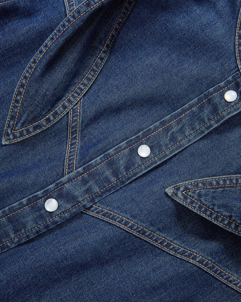 Veronica Beard Blue denim shirt with pearl snap buttons.