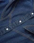 Veronica Beard Blue denim shirt with pearl snap buttons.