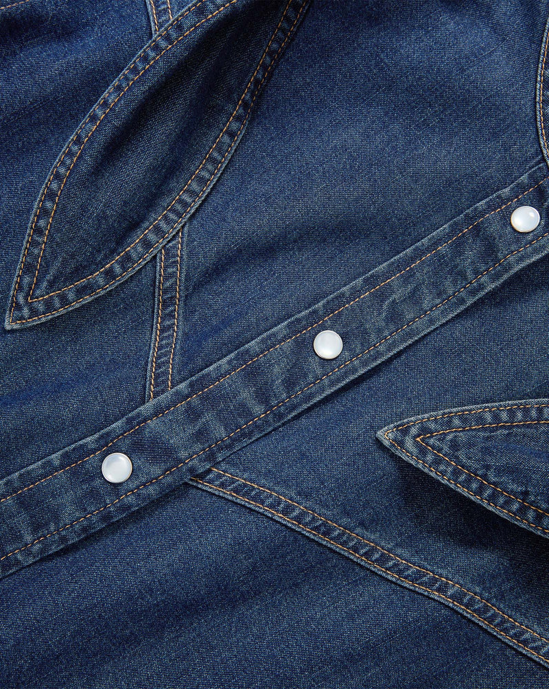 Veronica Beard Blue denim shirt with pearl snap buttons.