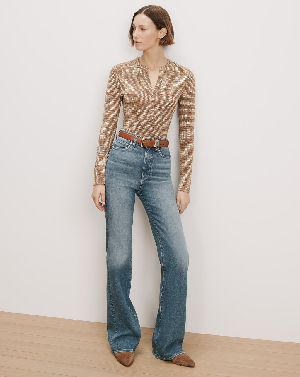 Veronica Beard Brown knit henley, blue flare jeans, brown belt.
