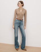 Veronica Beard Brown knit henley, blue flare jeans, brown belt.