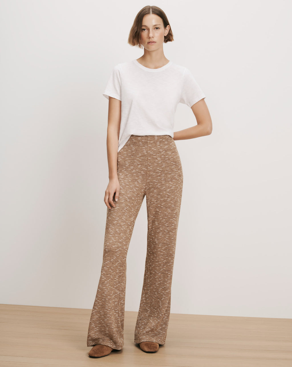 Veronica Beard White t-shirt, brown knit flared pants.