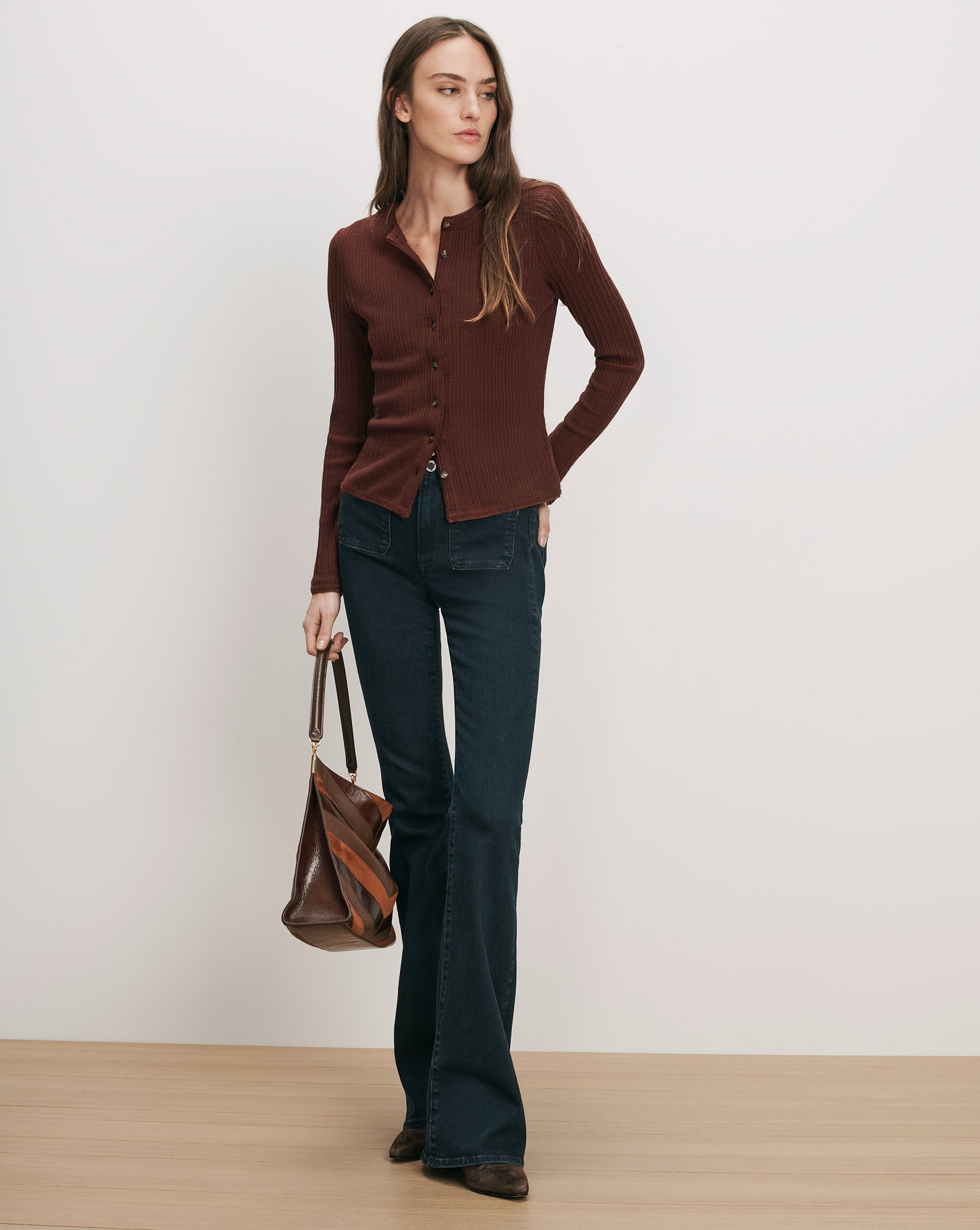 Veronica Beard Brown ribbed cardigan, dark wash flare jeans.