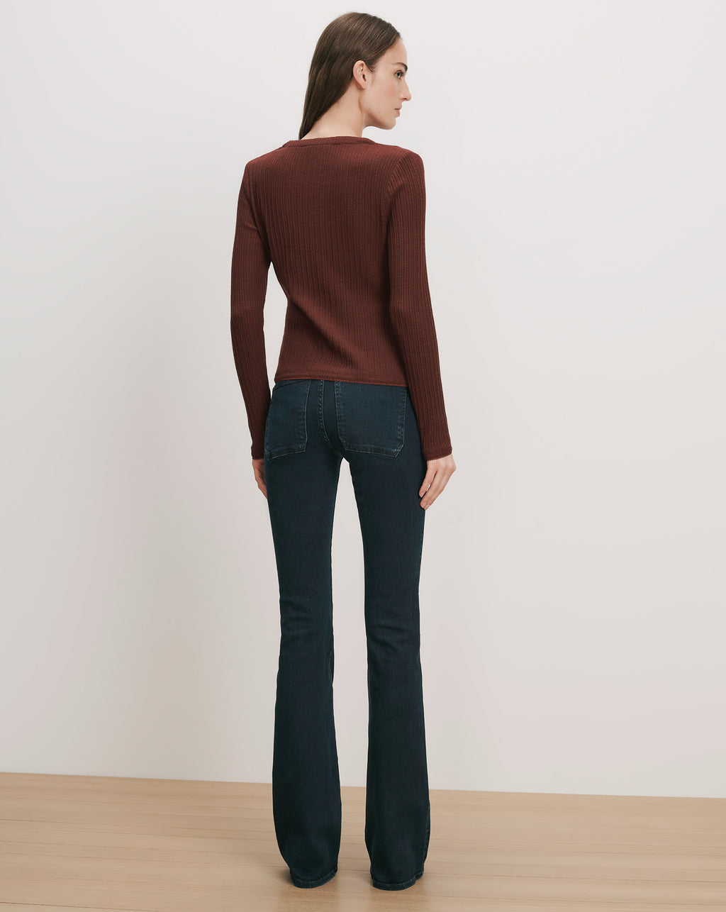Veronica Beard Brown ribbed long-sleeve top and dark wash flare jeans.