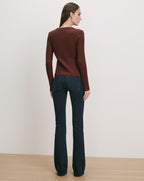 Veronica Beard Brown ribbed long-sleeve top and dark wash flare jeans.