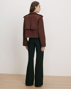 Veronica Beard Brown cropped jacket with wide-leg black pants.