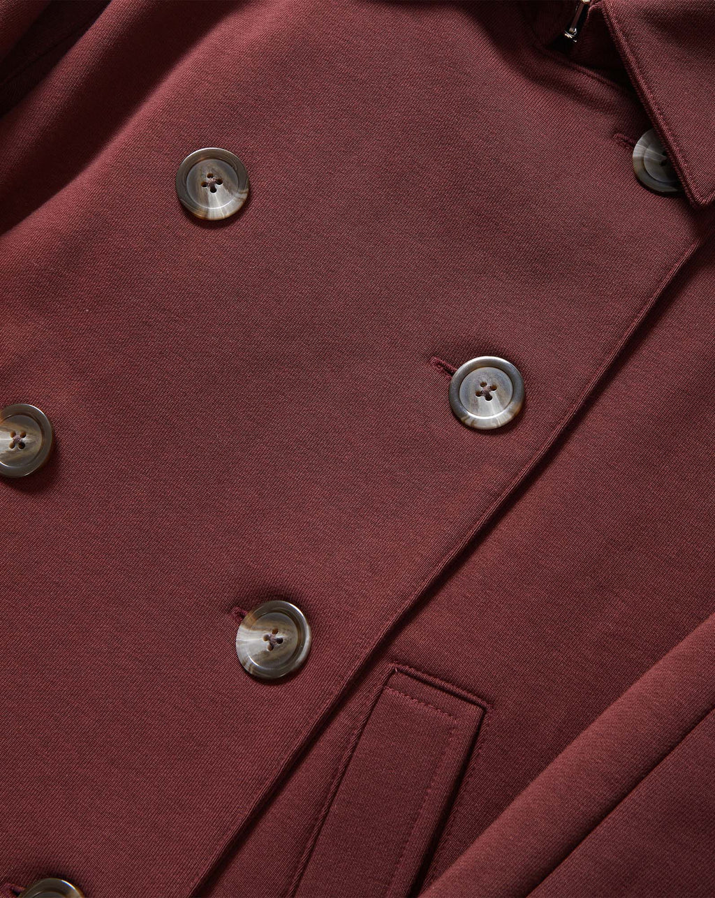 Veronica Beard Burgundy double-breasted coat with brown buttons.