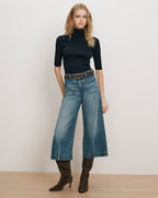 Veronica Beard Navy ribbed turtleneck, wide-leg jeans, brown boots