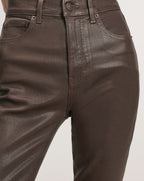 Veronica Beard Brown coated denim jeans with five pockets.