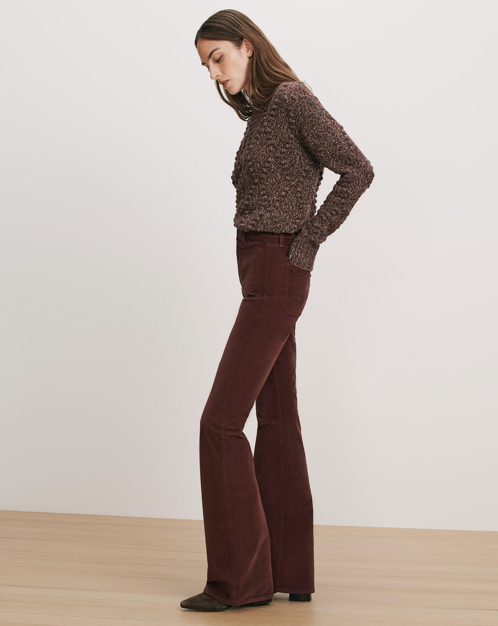 Veronica Beard Brown knit sweater and brown corduroy flare pants.