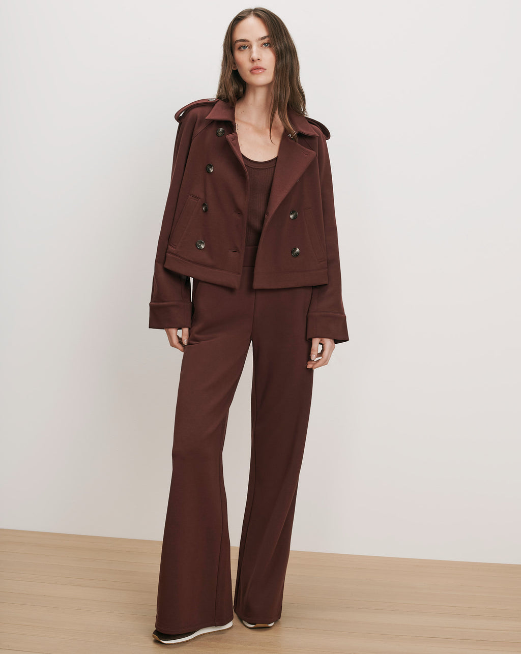 Veronica Beard Brown peacoat, tank top, and wide-leg pants set.