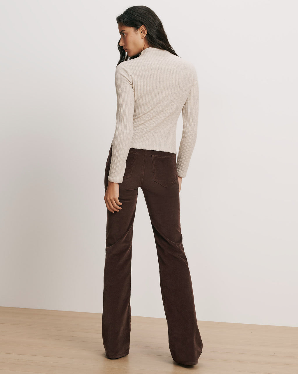 Veronica Beard Beige ribbed long-sleeve top and brown corduroy pants.