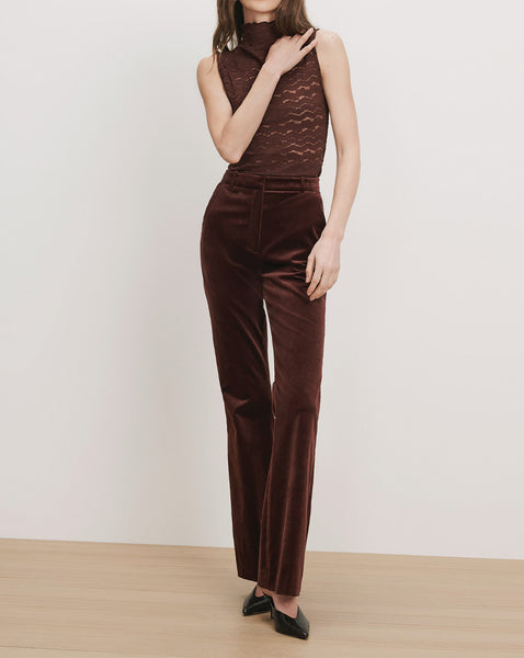 Veronica Beard Burgundy velvet high-waisted straight-leg trousers.