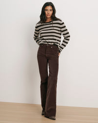 Veronica Beard Brown and white striped sweater, brown corduroy flare pants.