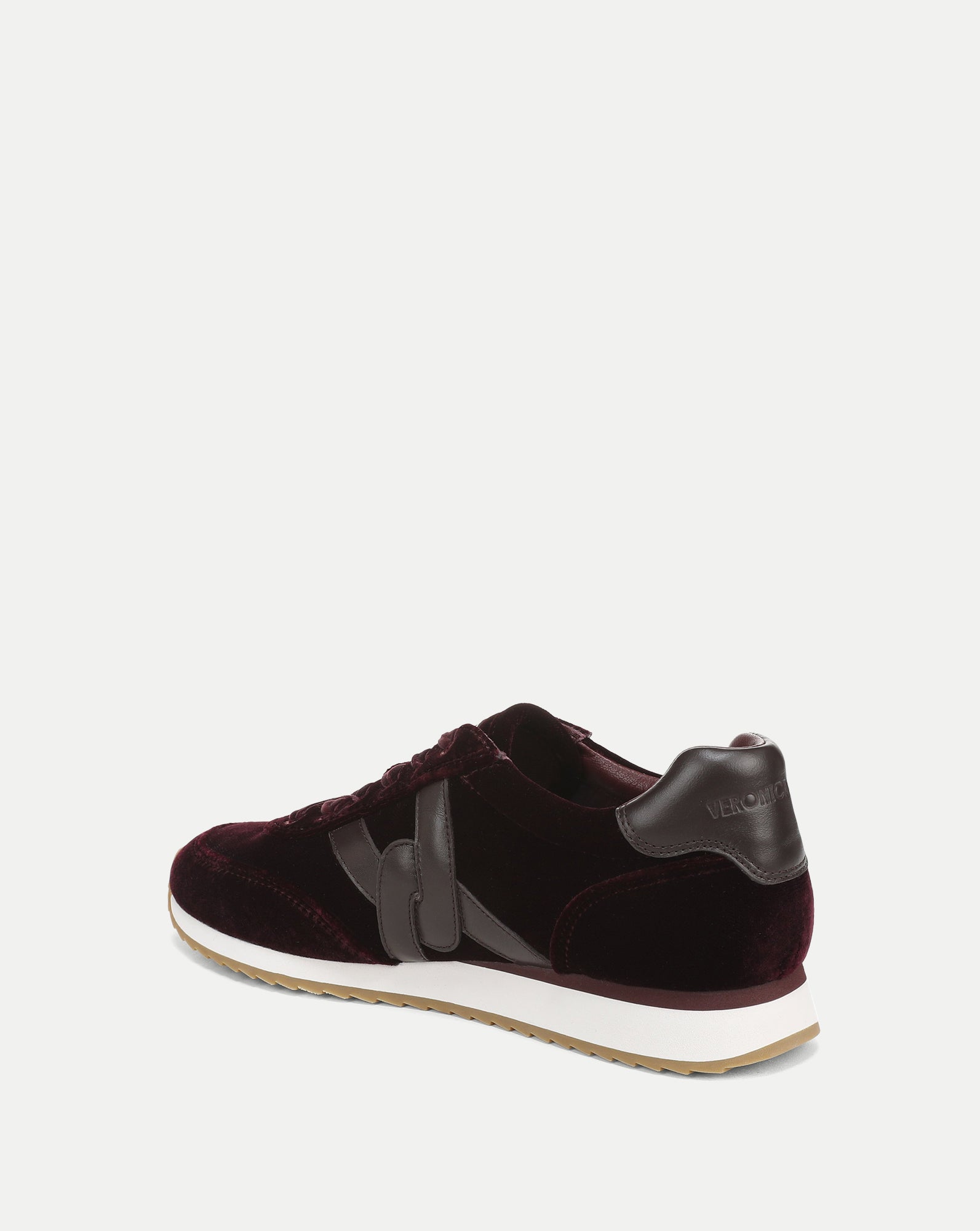 Veronica Beard Burgundy velvet sneakers with brown leather accents.