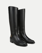 Veronica Beard Black leather knee-high boots with gold buckle.