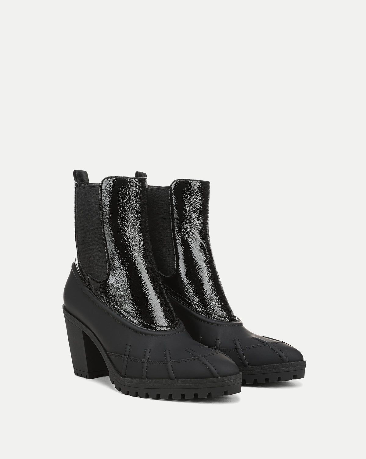 Veronica Beard Black patent leather and rubber heeled boots.