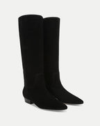 Veronica Beard Black suede knee-high boots with pointed toes.