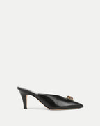 Veronica Beard Black leather mule with pointed toe and gold buckle.