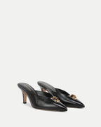 Veronica Beard Black leather mules with pointed toe and tiger's eye embellishment.