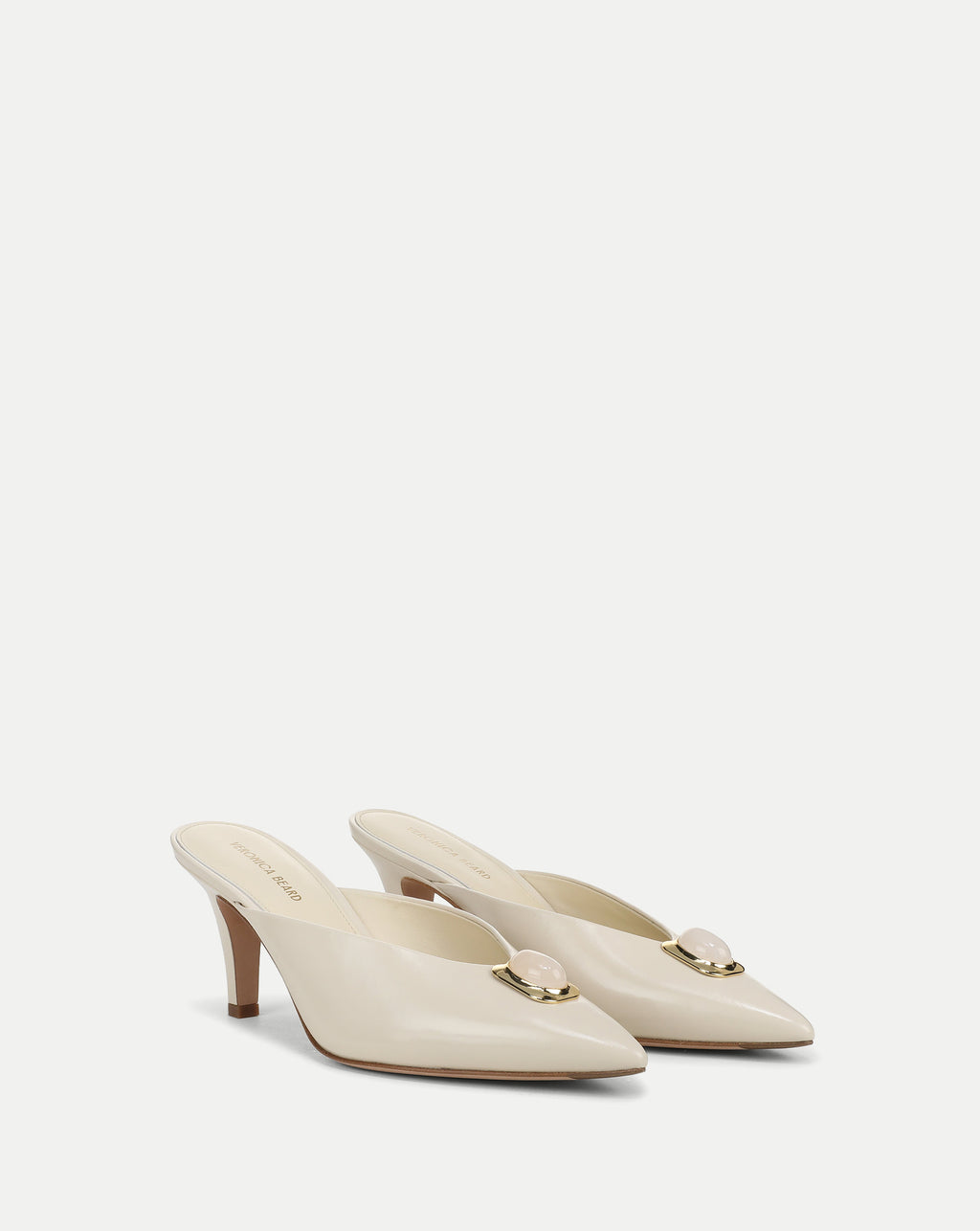 Veronica Beard Cream leather mules with gold and pink stone detail.