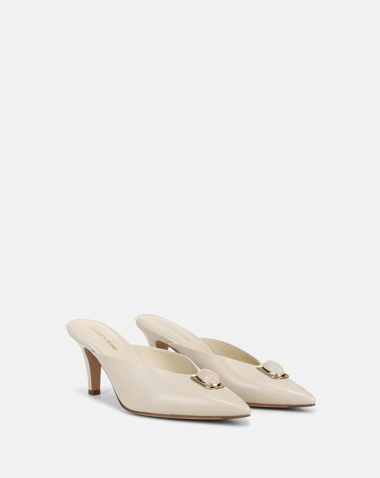 Veronica Beard Cream leather mules with gold and pink stone detail.