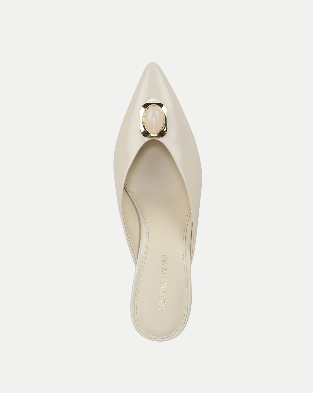 Veronica Beard Cream leather pointed-toe mule with gold and pink buckle.