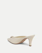 Veronica Beard Cream leather mule with gold buckle and bow.
