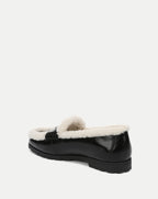 Veronica Beard Black patent leather shearling-lined slip-on loafer.