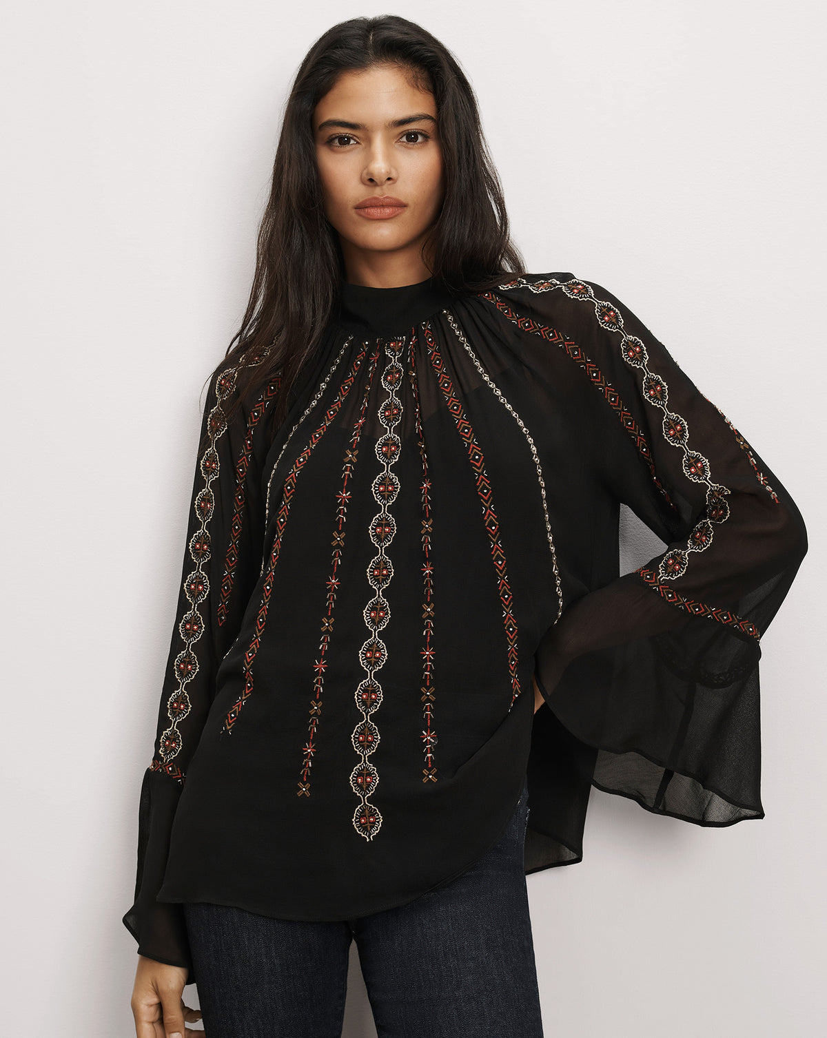 Veronica Beard Black sheer blouse with intricate red embroidery.