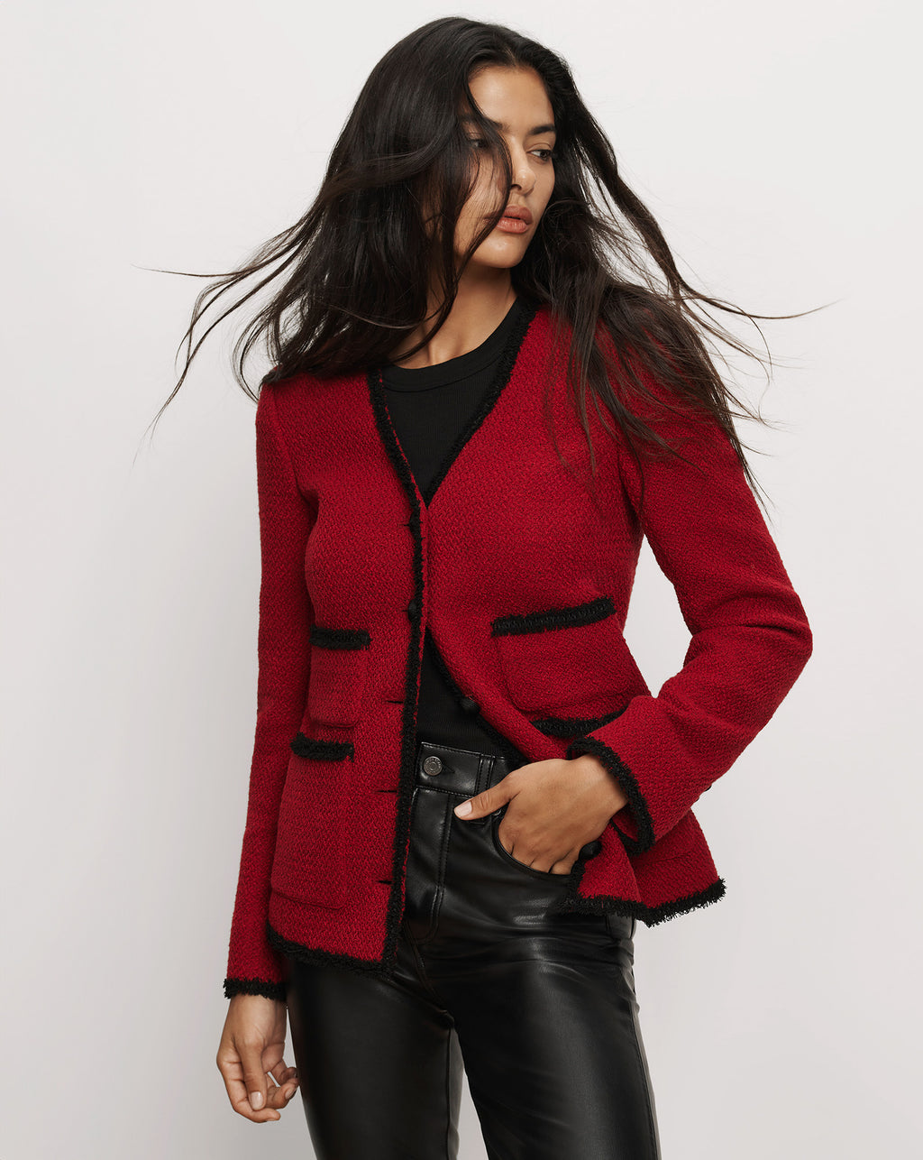Veronica Beard Red tweed jacket with black fringe trim.