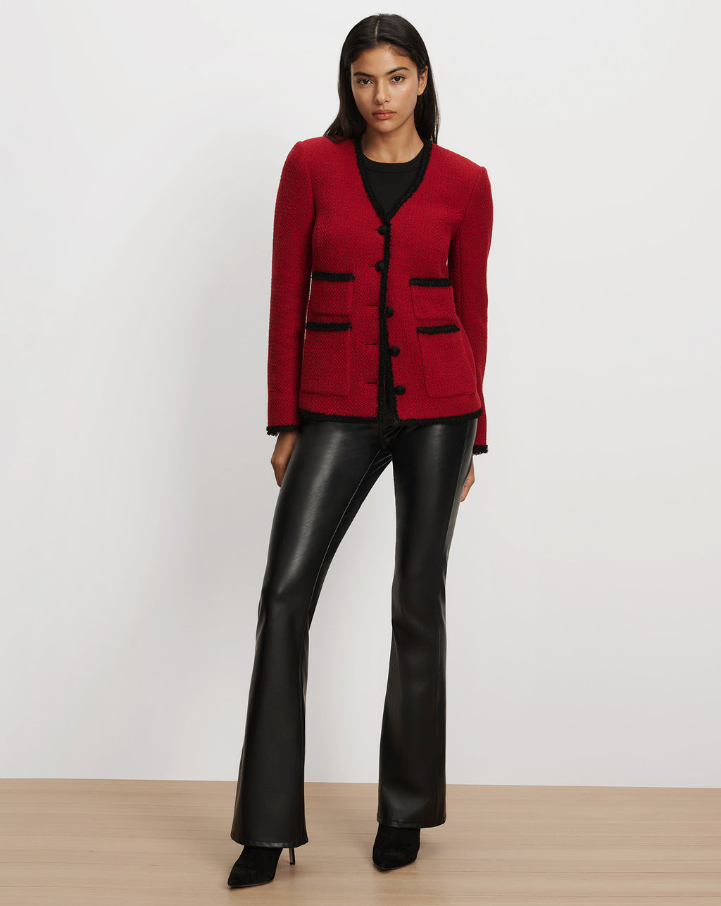 Veronica Beard Red tweed jacket with black trim and pockets.