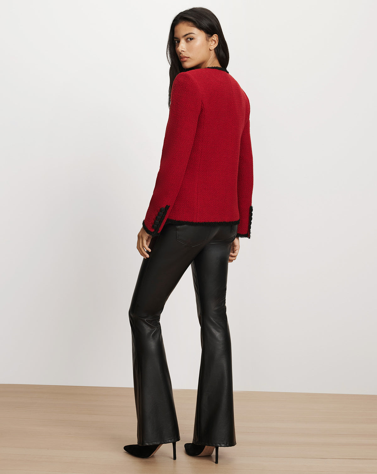 Veronica Beard Red tweed jacket with black trim.